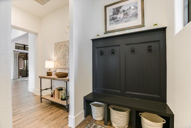 518 Doe Whisper Way, Austin, TX 78738 - mudroom featuring light wood-style flooring and baseboards