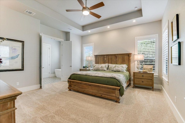 518 Doe Whisper Way, Austin, TX 78738 - bedroom featuring light carpet, recessed lighting, multiple windows, a tray ceiling, and a ceiling fan