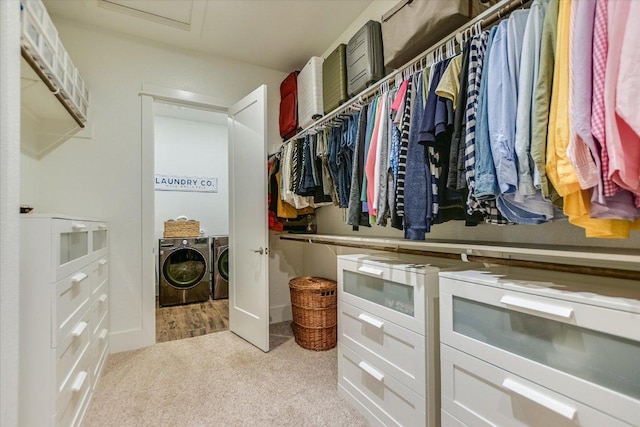 518 Doe Whisper Way, Austin, TX 78738 - walk in closet featuring independent washer and dryer, attic access, and carpet flooring