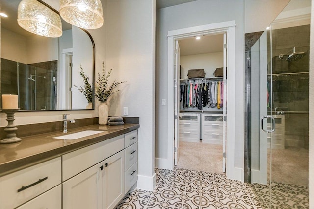 518 Doe Whisper Way, Austin, TX 78738 - full bath featuring vanity, a stall shower, a walk in closet, and tile patterned flooring