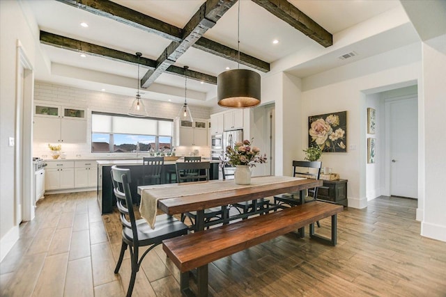 518 Doe Whisper Way, Austin, TX 78738 - dining area featuring beam ceiling, coffered ceiling, light wood finished floors, and recessed lighting
