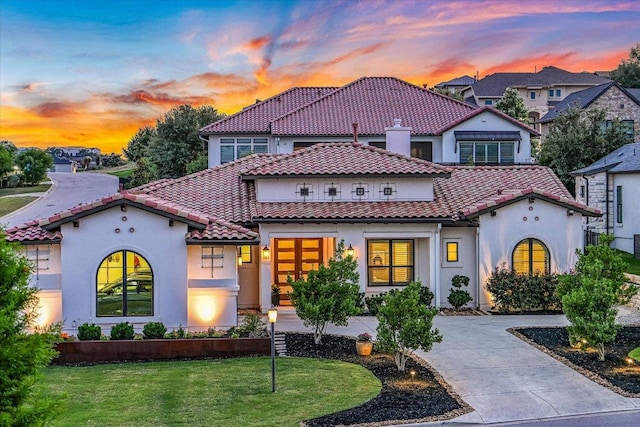 518 Doe Whisper Way, Austin, TX 78738 - mediterranean / spanish home with stucco siding, a tiled roof, and a lawn