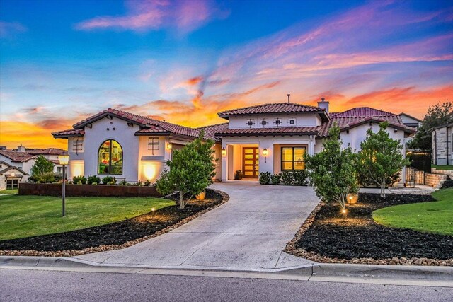 518 Doe Whisper Way, Austin, TX 78738 - mediterranean / spanish-style home featuring stucco siding, a tiled roof, a lawn, driveway, and a chimney