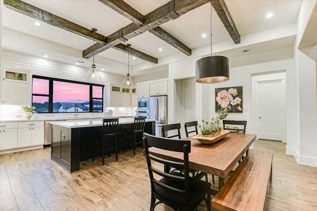 518 Doe Whisper Way, Austin, TX 78738 - dining area with light wood-style flooring, beam ceiling, and recessed lighting