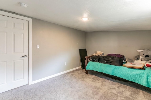 carpeted bedroom with baseboards