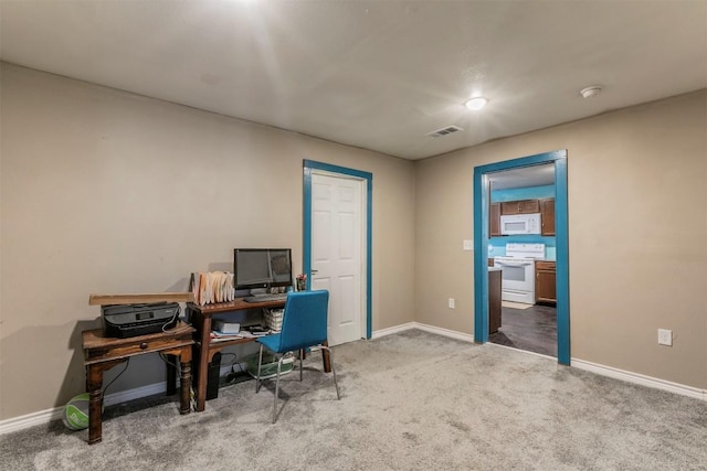 home office with visible vents, baseboards, and carpet floors