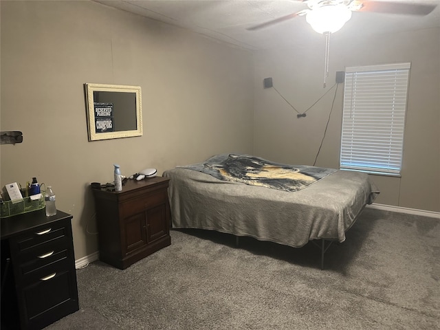 409 E Houston St, Mexia, TX 76667 - bedroom with dark carpet, ceiling fan, and baseboards