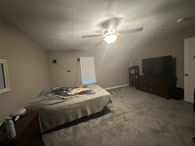 409 E Houston St, Mexia, TX 76667 - bedroom featuring light carpet and ceiling fan
