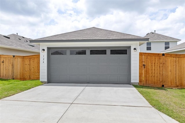 124 Rollingwood Dr, San Marcos, TX 78666 - view of front facade with a garage, a shingled roof, and concrete driveway
