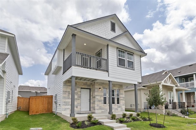 124 Rollingwood Dr, San Marcos, TX 78666 - view of front of home featuring a balcony, a porch, and stone siding