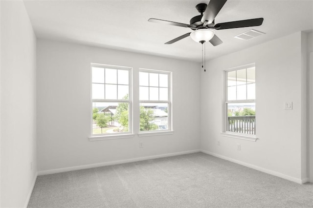 124 Rollingwood Dr, San Marcos, TX 78666 - spare room featuring healthy amount of natural light, ceiling fan, and baseboards