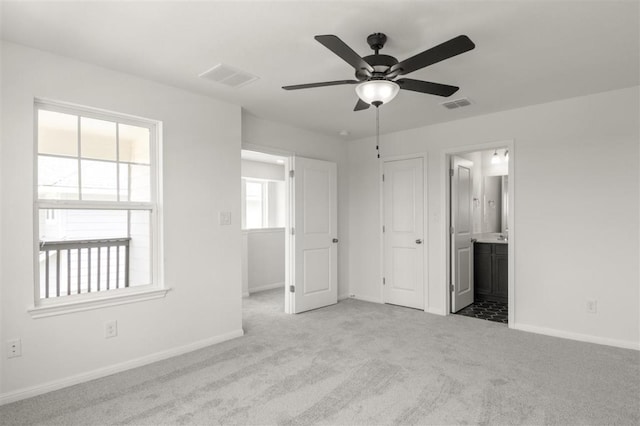 124 Rollingwood Dr, San Marcos, TX 78666 - unfurnished bedroom with carpet flooring, baseboards, and ensuite bath