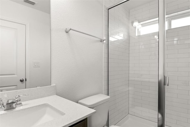 124 Rollingwood Dr, San Marcos, TX 78666 - bathroom with vanity, toilet, and a stall shower