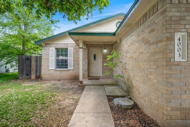 4003 Reeders Dr, Austin, TX 78725 - doorway to property with brick siding