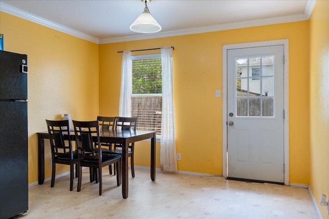 4003 Reeders Dr, Austin, TX 78725 - dining space with crown molding and light floors