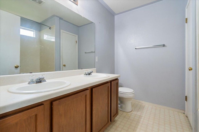 4003 Reeders Dr, Austin, TX 78725 - bathroom featuring tile patterned floors, double vanity, and a shower