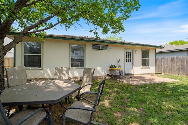 4003 Reeders Dr, Austin, TX 78725 - rear view of property featuring a patio and outdoor dining space