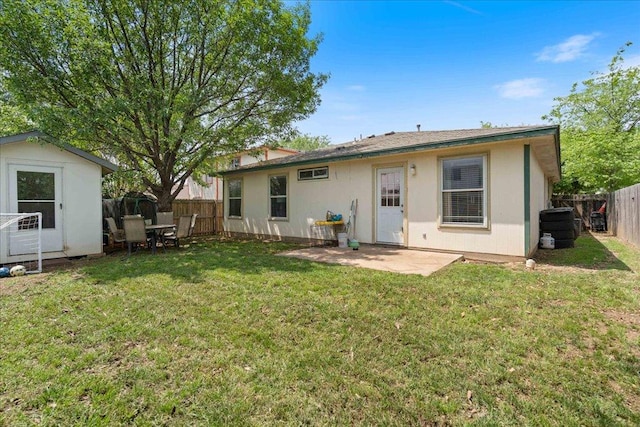 4003 Reeders Dr, Austin, TX 78725 - rear view of property featuring a fenced backyard, a shed, and a patio