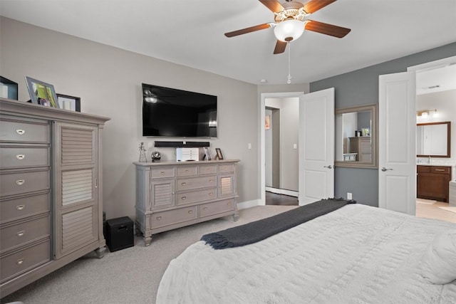 104 Atlanta Park Dr, Georgetown, TX 78628 - bedroom with light colored carpet, ensuite bath, ceiling fan, and baseboards