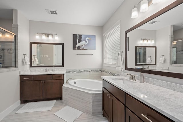 104 Atlanta Park Dr, Georgetown, TX 78628 - full bath with a stall shower, a garden tub, and two vanities
