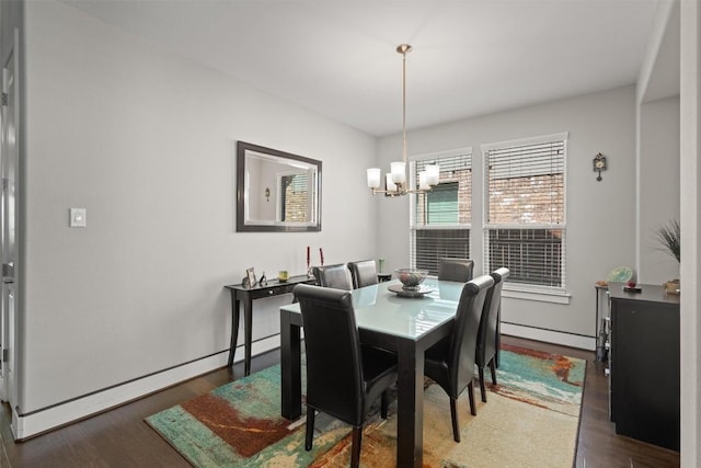 104 Atlanta Park Dr, Georgetown, TX 78628 - dining area featuring a chandelier, wood finished floors, and a baseboard heating unit