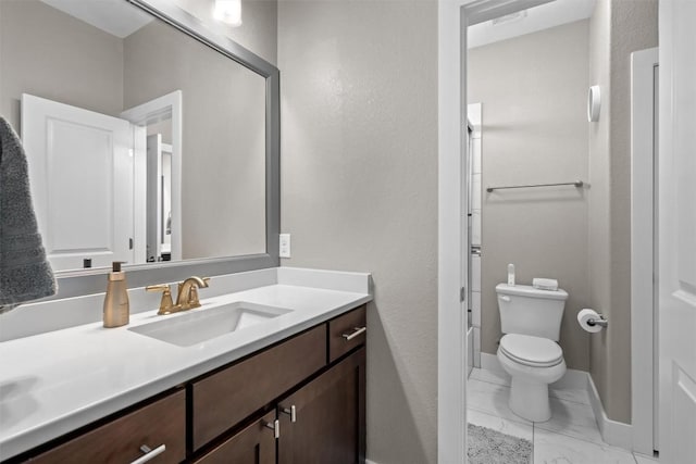 104 Atlanta Park Dr, Georgetown, TX 78628 - bathroom featuring vanity, marble finish flooring, toilet, and baseboards