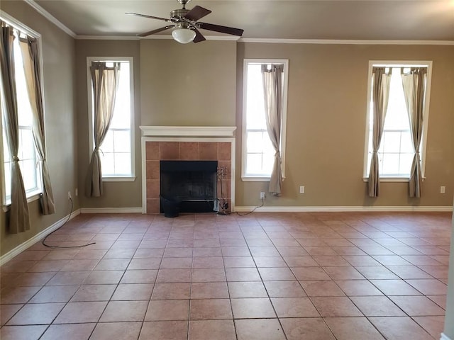 unfurnished living room featuring a ceiling fan, ornamental molding, and light tile patterned flooring
