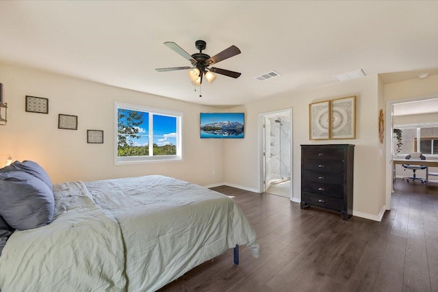 11208 Mickelson Dr, Austin, TX 78747 - bedroom with dark wood-style floors, ensuite bath, and a ceiling fan