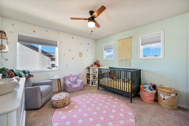 11208 Mickelson Dr, Austin, TX 78747 - carpeted bedroom with a nursery area and ceiling fan