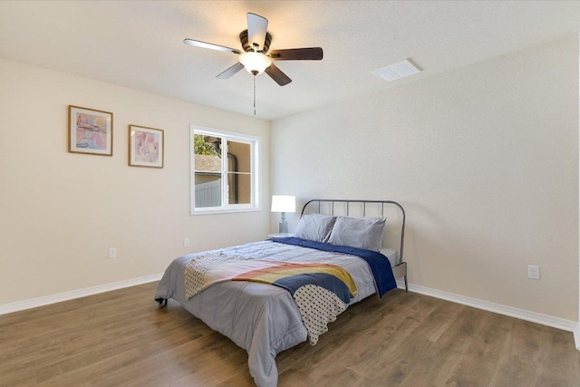 11208 Mickelson Dr, Austin, TX 78747 - bedroom featuring wood finished floors and a ceiling fan