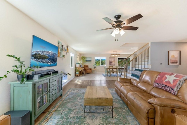 11208 Mickelson Dr, Austin, TX 78747 - living area featuring wood finished floors, stairs, and a ceiling fan