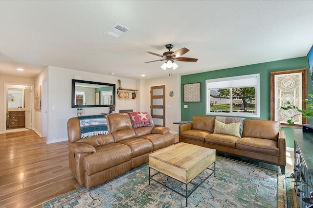 11208 Mickelson Dr, Austin, TX 78747 - living room featuring wood finished floors, a ceiling fan, and recessed lighting