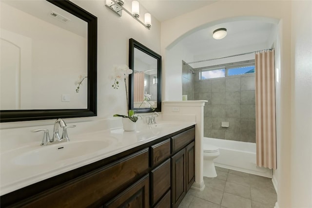 12325 Labrador Bay Ct, Austin, TX 78732 - full bath featuring toilet, tile patterned flooring, double vanity, and shower / tub combo