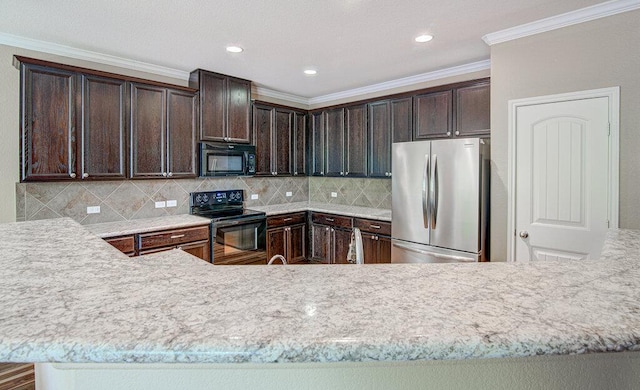 kitchen with dark brown cabinets, tasteful backsplash, crown molding, and black appliances