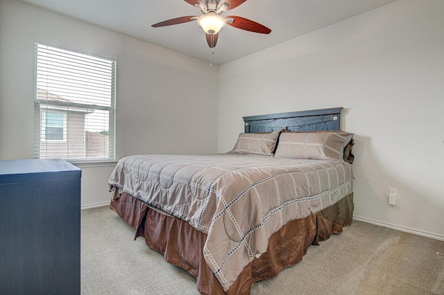 bedroom with baseboards, light colored carpet, and ceiling fan