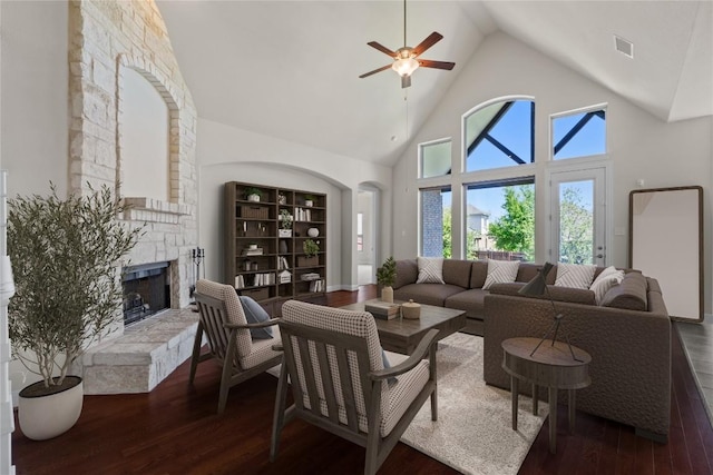 118 Bluehaw Dr, Georgetown, TX 78628 - living room featuring high vaulted ceiling, hardwood / wood-style flooring, a stone fireplace, and ceiling fan