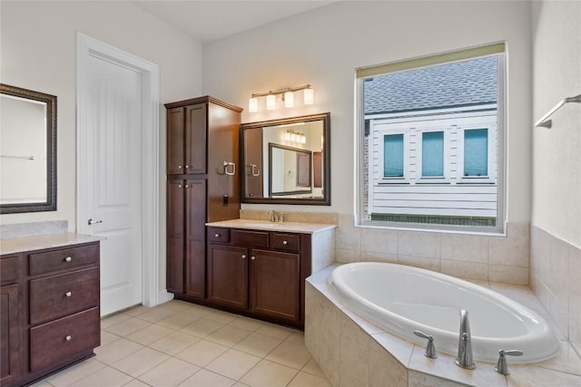 118 Bluehaw Dr, Georgetown, TX 78628 - full bath featuring two vanities, a bath, and tile patterned flooring