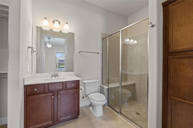 118 Bluehaw Dr, Georgetown, TX 78628 - full bathroom with toilet, a stall shower, vanity, tile patterned flooring, and a ceiling fan