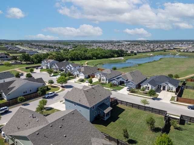 drone / aerial view with a water view and a residential view
