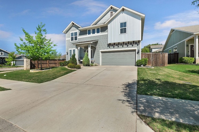view of front of property featuring an attached garage, driveway, a front yard, and fence