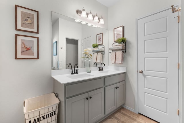 full bath featuring double vanity and a sink