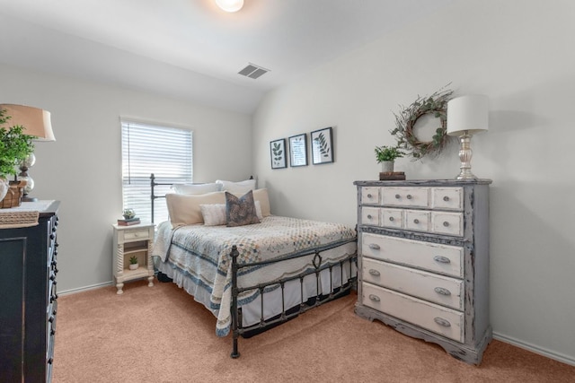bedroom with light carpet, visible vents, baseboards, and vaulted ceiling