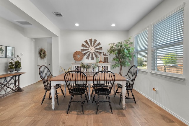 dining area with wood finished floors, baseboards, visible vents, and recessed lighting