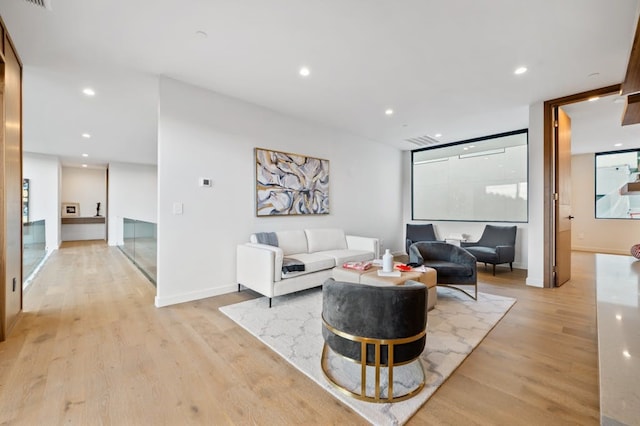 3500 Cactus Wren Way, Austin, TX 78746 - living room with light wood-style flooring, recessed lighting, and baseboards