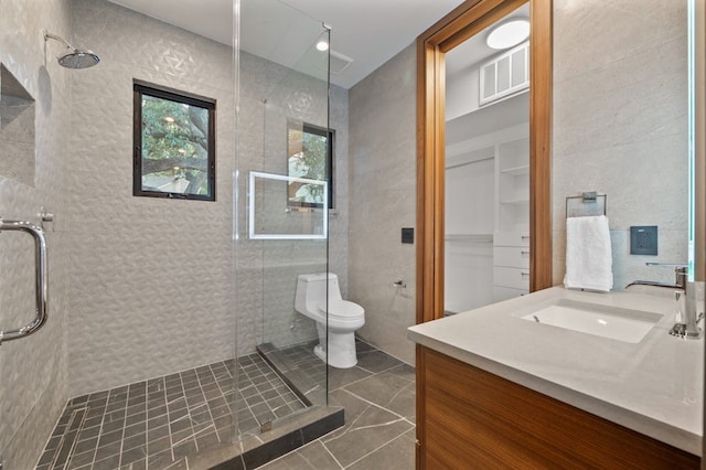3500 Cactus Wren Way, Austin, TX 78746 - full bath featuring a tile shower, vanity, toilet, and tile walls