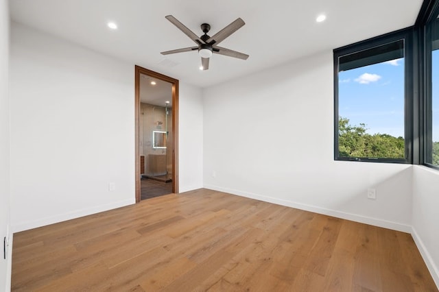 3500 Cactus Wren Way, Austin, TX 78746 - unfurnished room with recessed lighting, baseboards, a ceiling fan, and wood finished floors