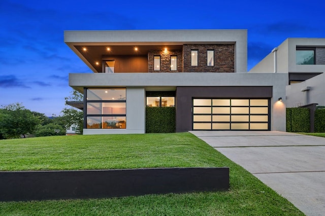 3500 Cactus Wren Way, Austin, TX 78746 - modern home with driveway, stucco siding, a front yard, and a garage