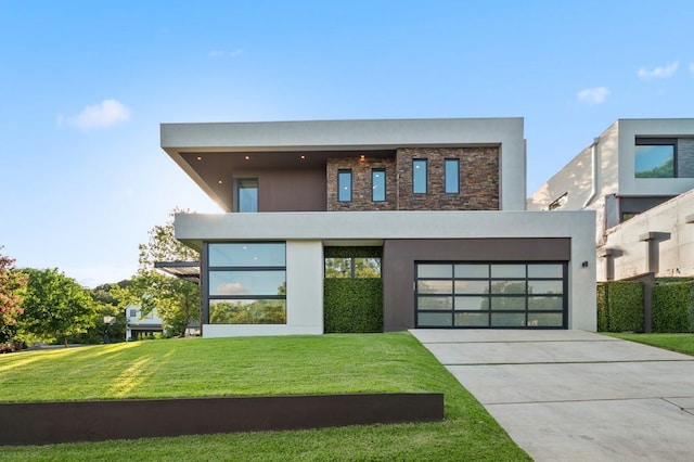3500 Cactus Wren Way, Austin, TX 78746 - modern home featuring driveway, a front lawn, stucco siding, and an attached garage