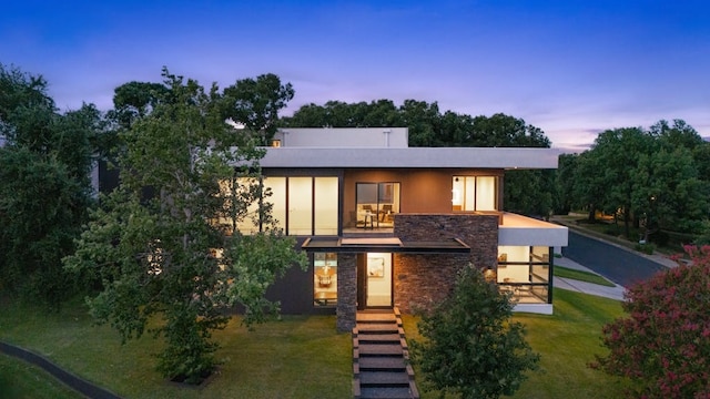 3500 Cactus Wren Way, Austin, TX 78746 - contemporary house featuring stone siding, a yard, and a balcony