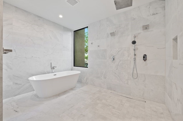 3500 Cactus Wren Way, Austin, TX 78746 - bathroom with a marble finish shower, a freestanding bath, tile walls, and recessed lighting